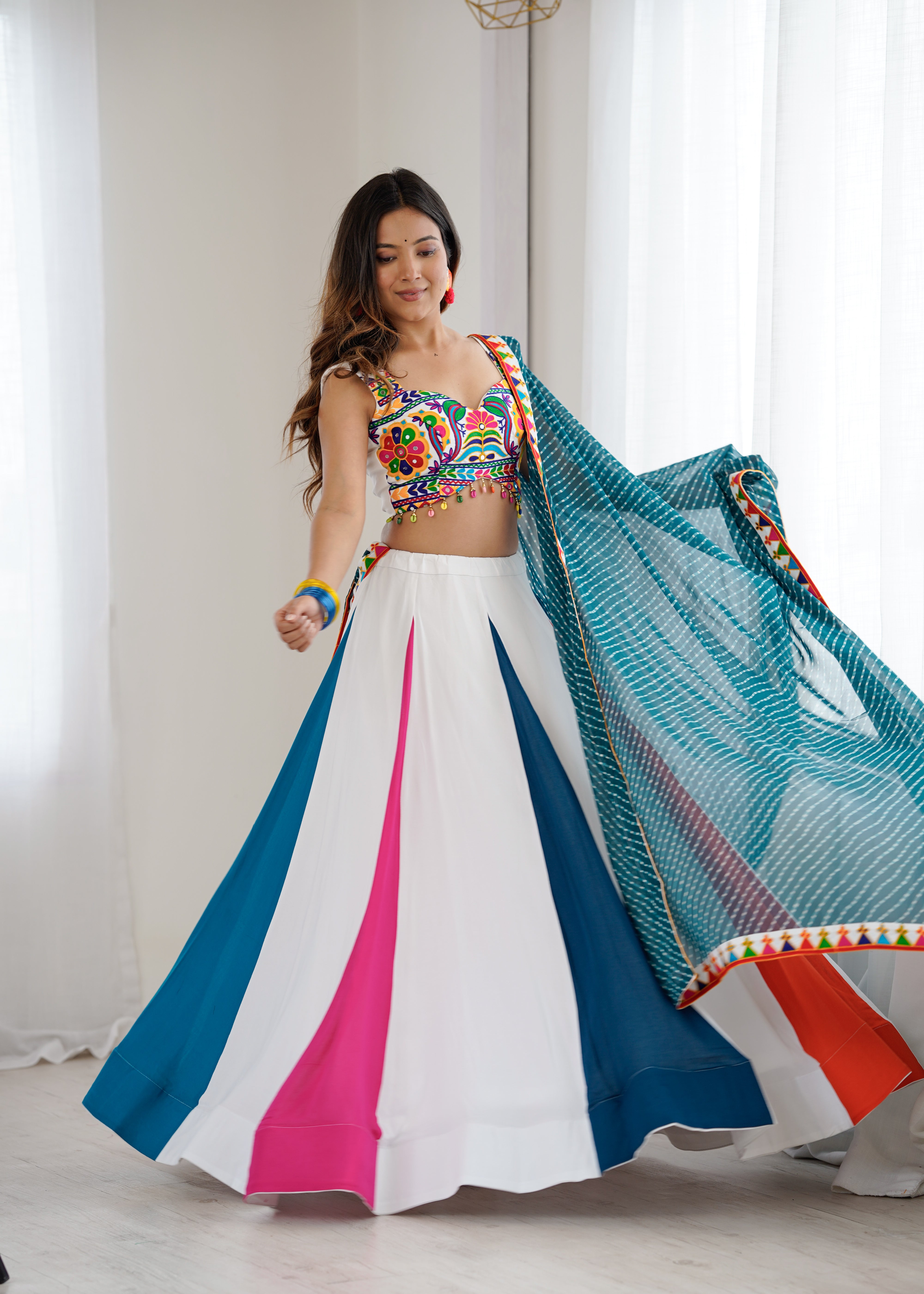 Navrang Gamthi Mirror Work Heavy Rayon Lehenga Choli with Dupatta
